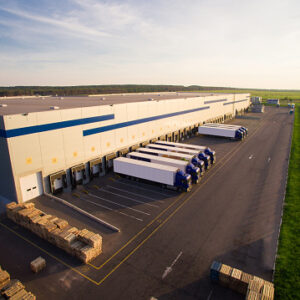 distribution warehouse with trucks of different capacity.